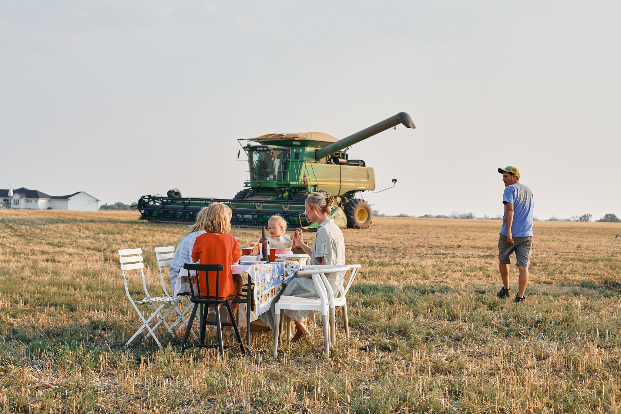family out in the field having supper