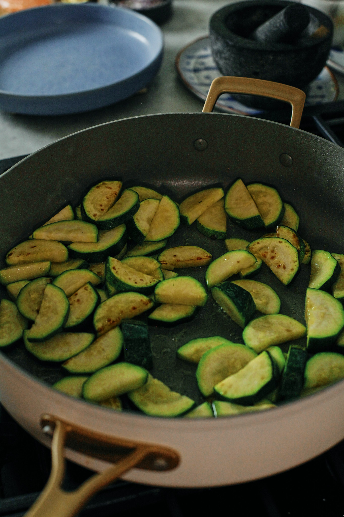 zucchini sauteeing in pan