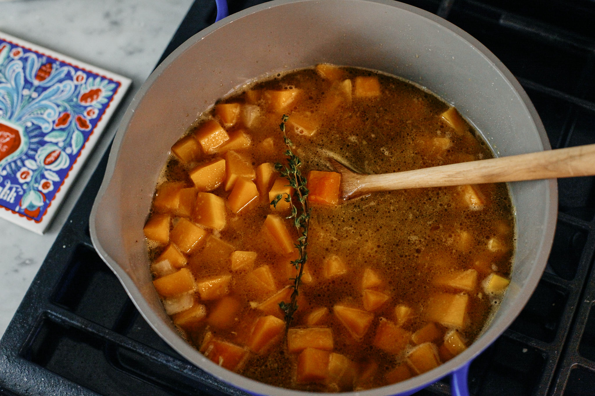 butternut squash soup with broth simmering