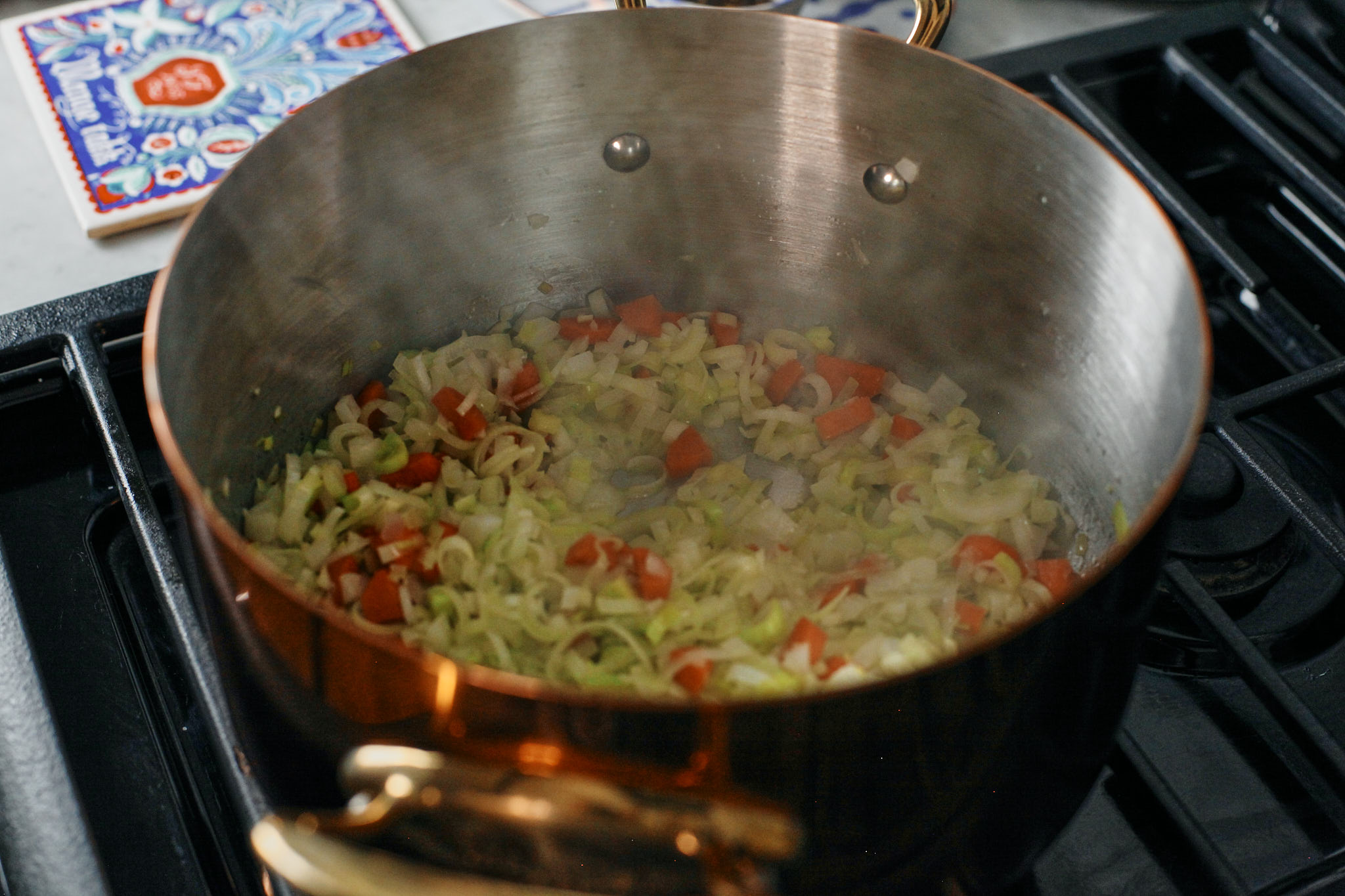 leek, onion, carrot and garlic sauteeing in a pot