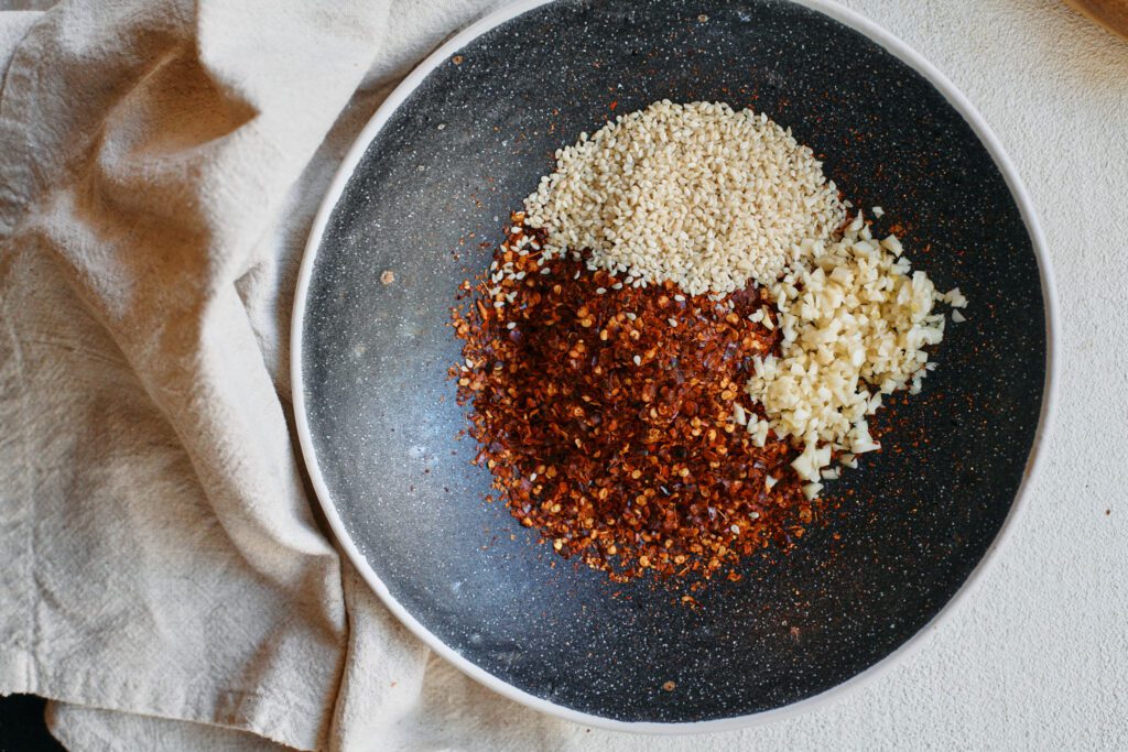 red chili flakes, sesame seeds and minced garlic