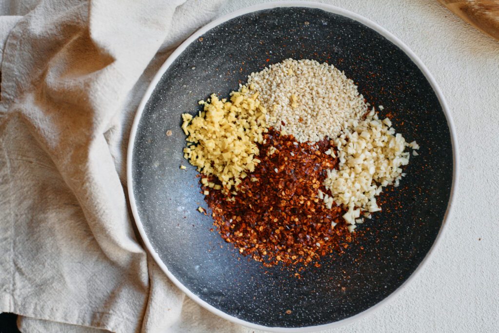 red chili flakes, sesame seeds, minced garlic and ginger