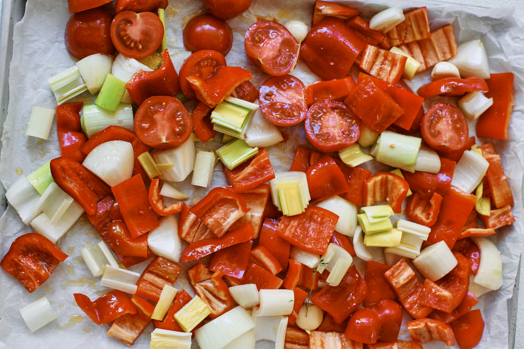 chopped red peppers, leeks, tomatoes, garlic and onion