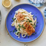 garlic butter salmon over creamy lemon pasta