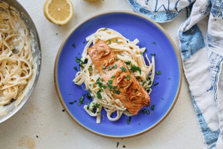 garlic butter salmon over creamy lemon pasta