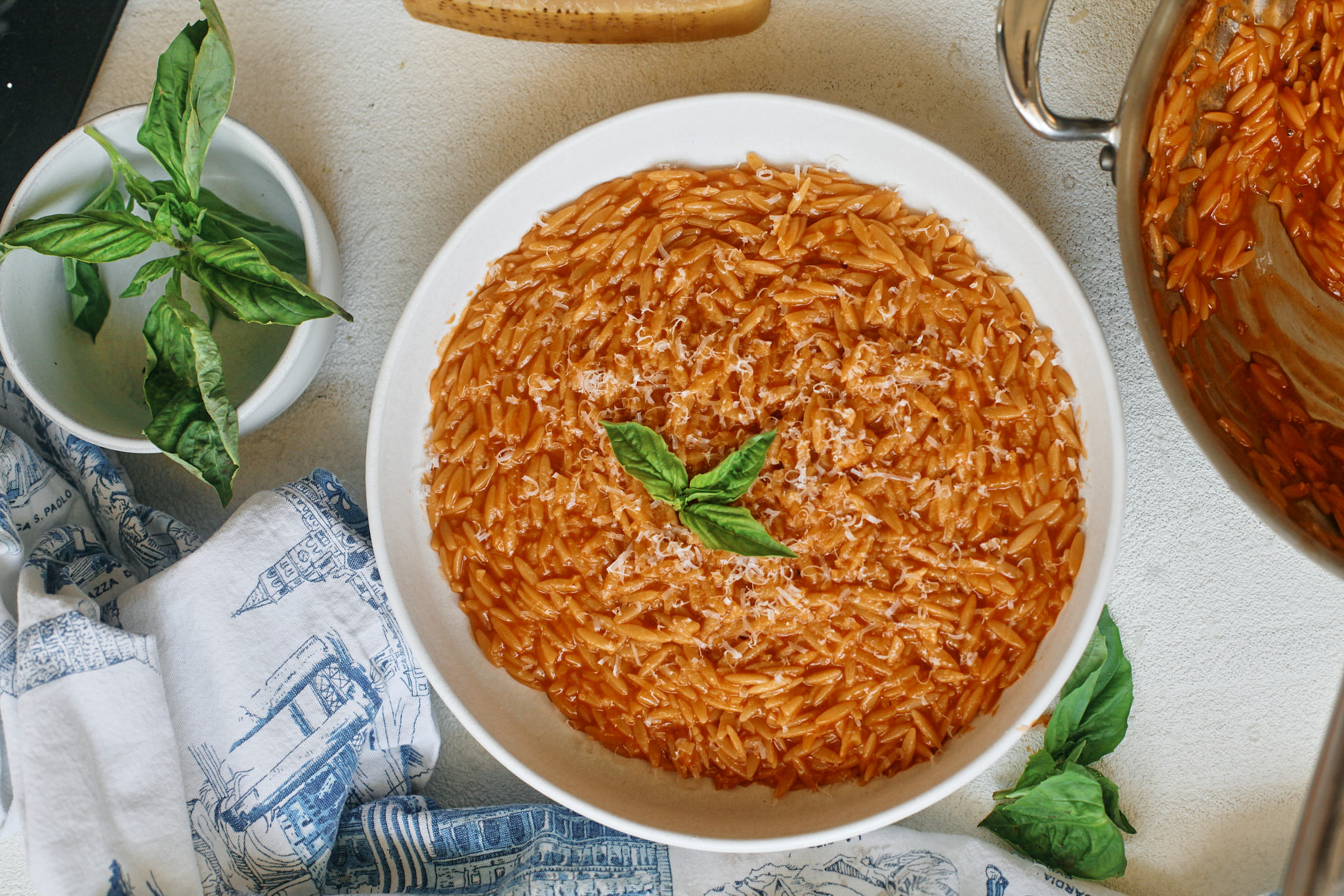 plated creamy tomato orzo topped with basil