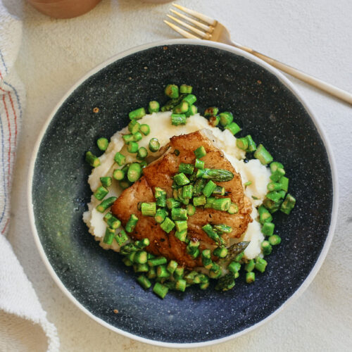 lemon butter cod over mashed potatoes with asparagus