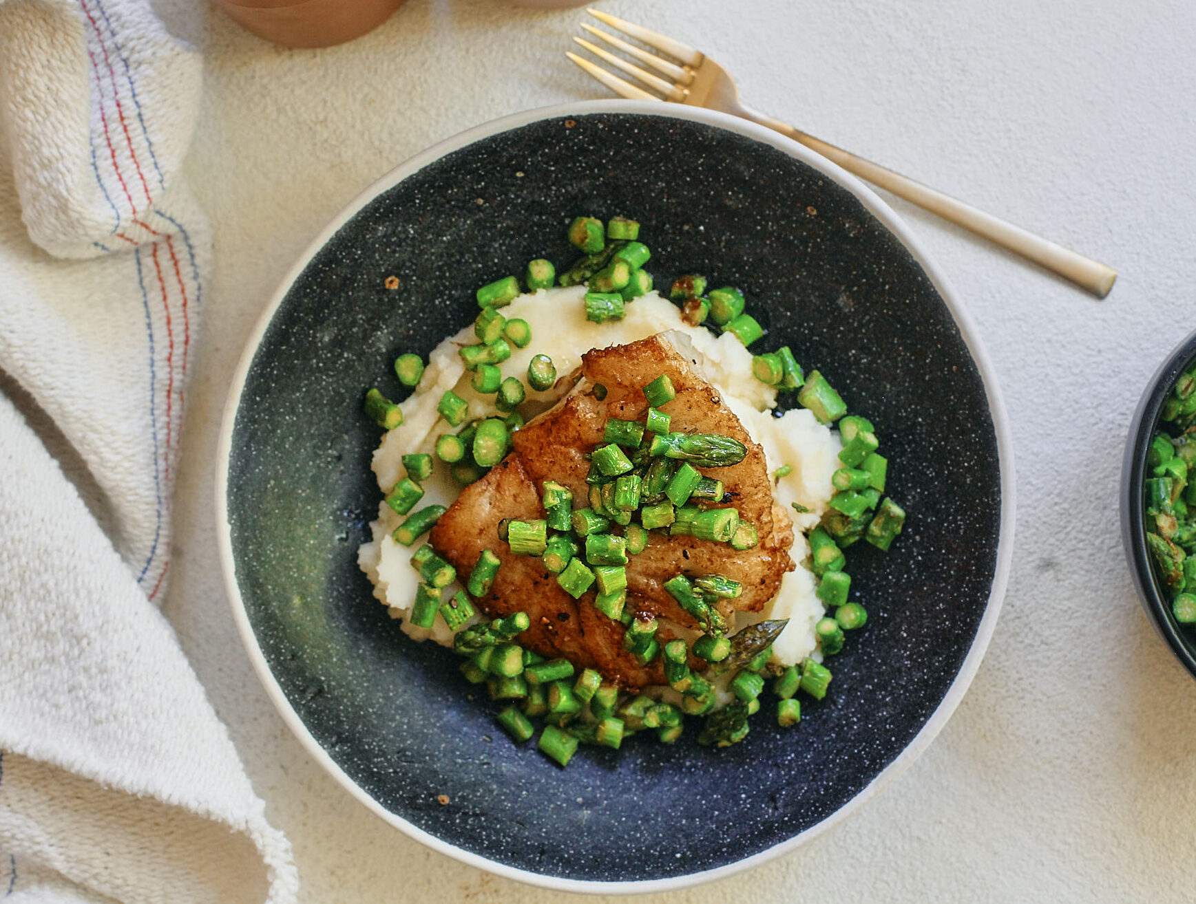 lemon butter cod over mashed potatoes with asparagus