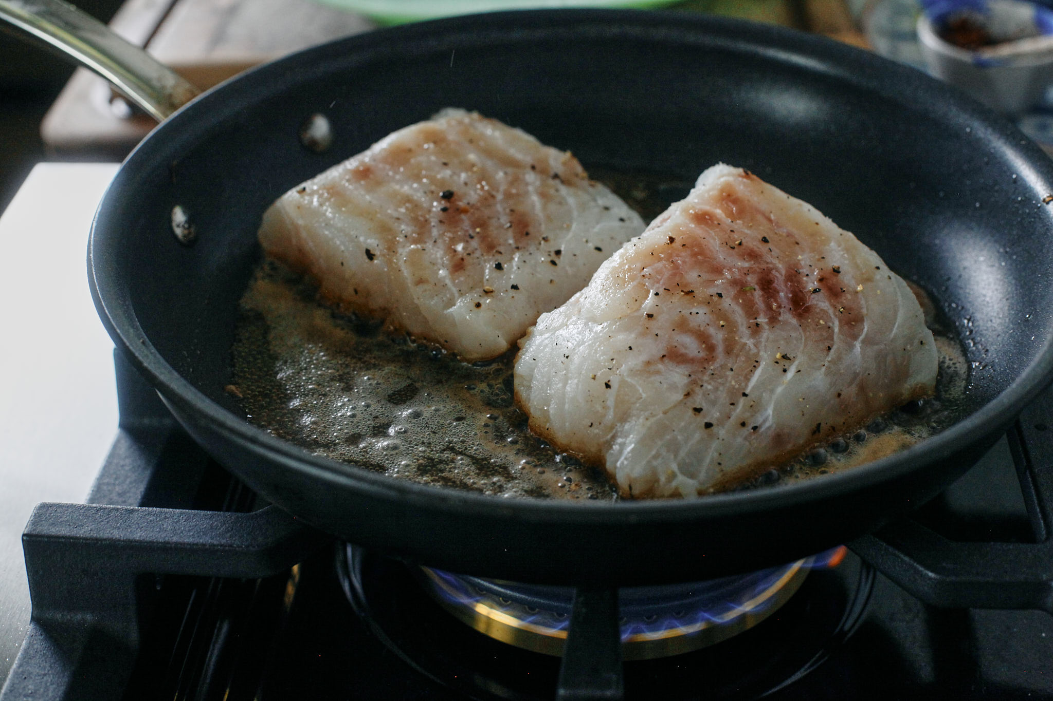 cod searing in butter and olive oil