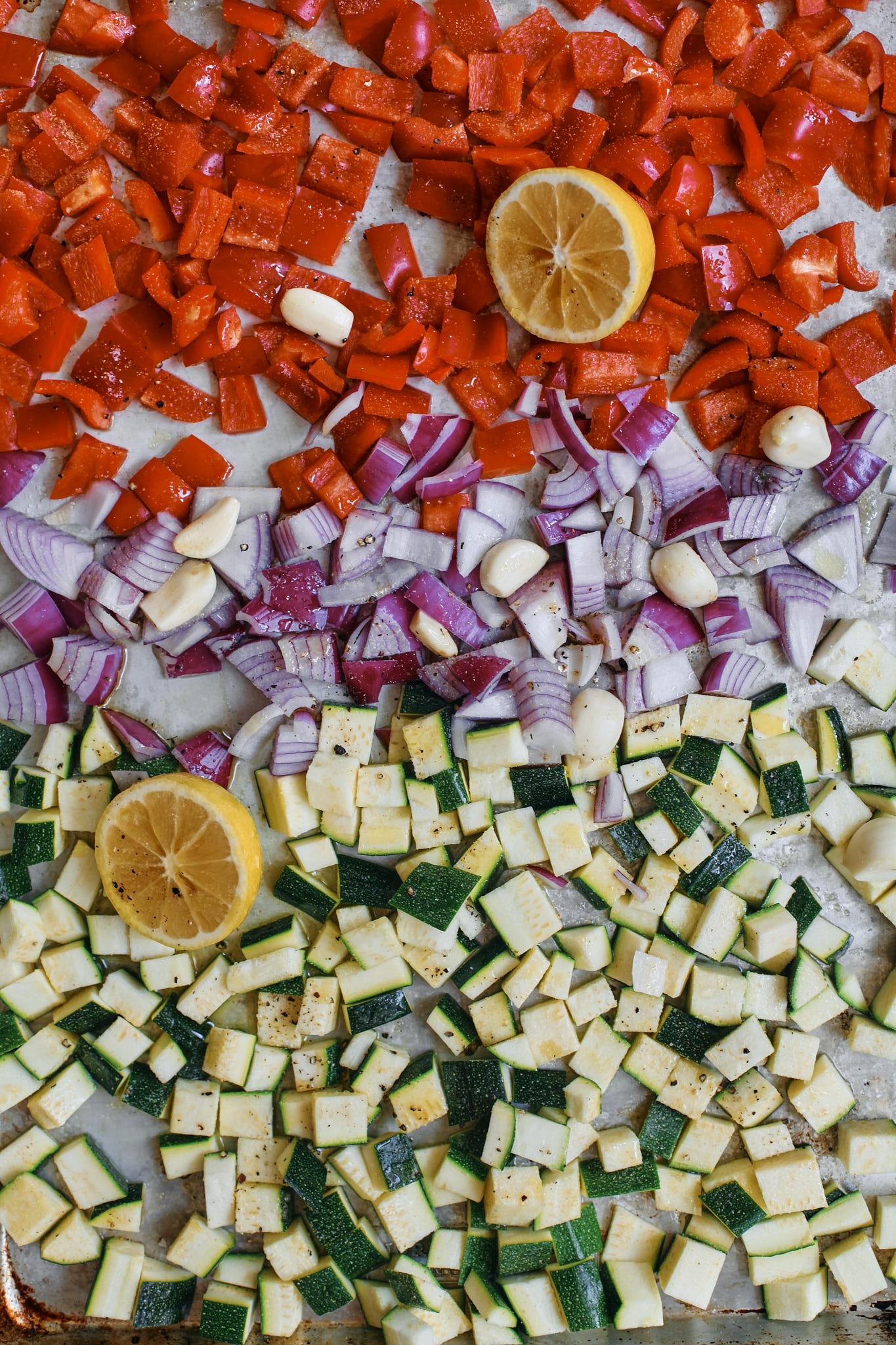 red pepper, red onion, zucchini, lemon about to be roasted