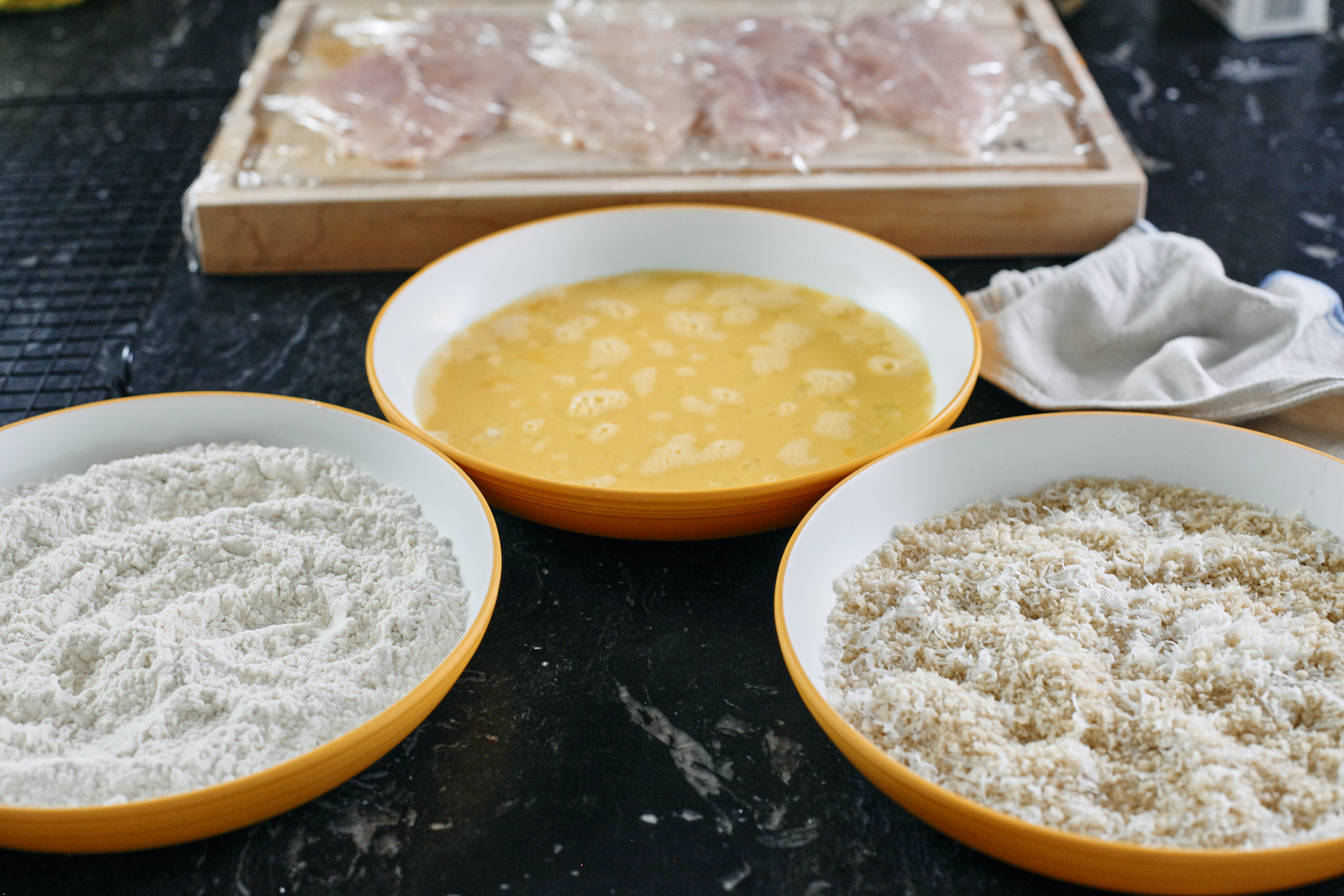 breading station for the chicken: flour, egg, and breadcrumbs