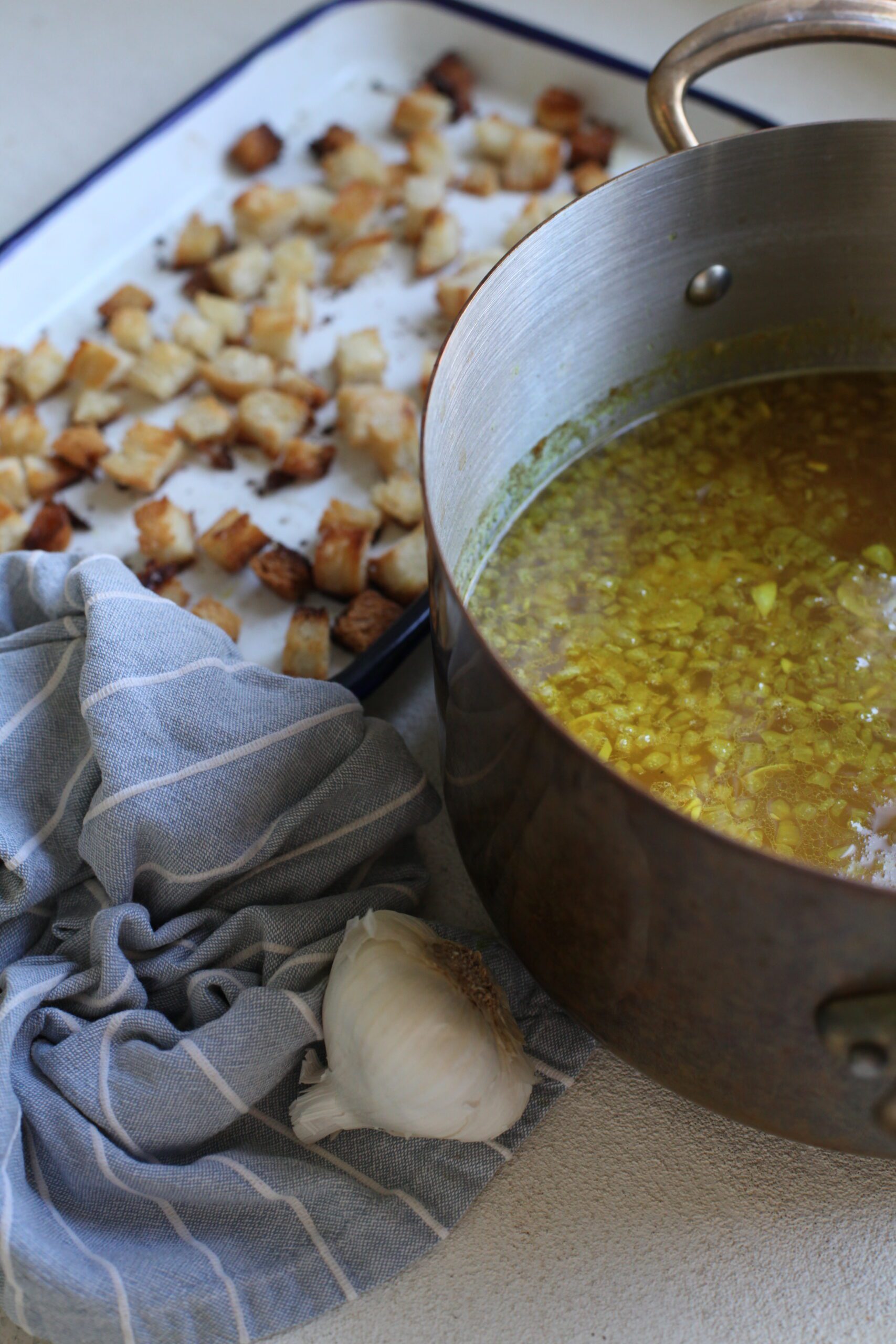 golden garlic soup and toasted croutons