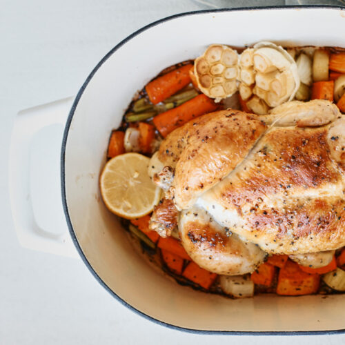 cooked one pot lemon pepper chicken in the pot with vegetables underneath