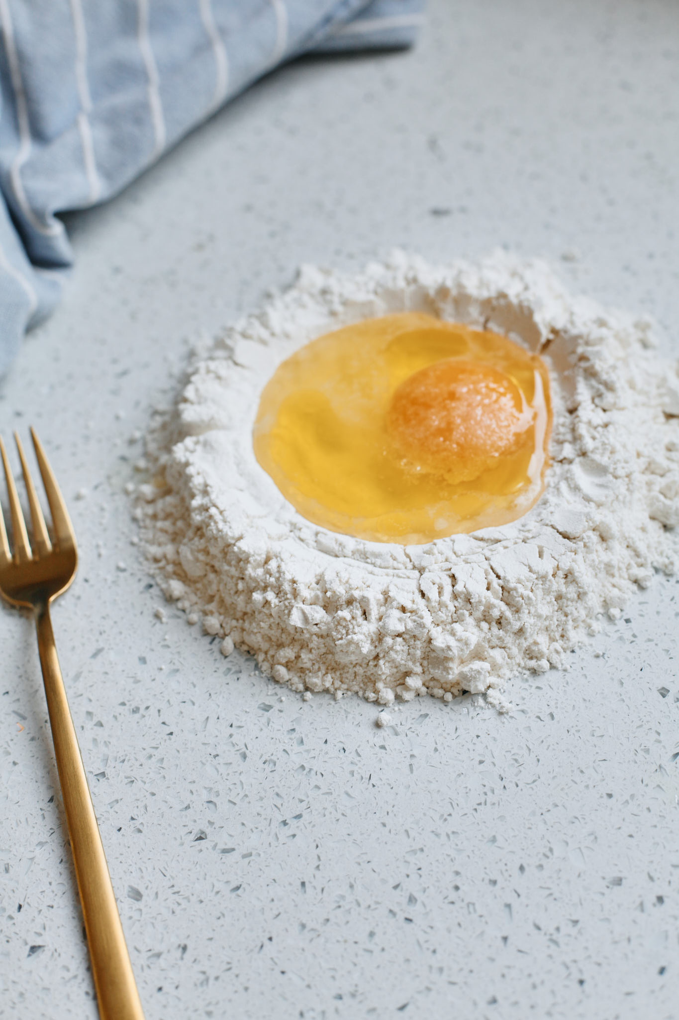 flour well with egg for homemade pasta dough