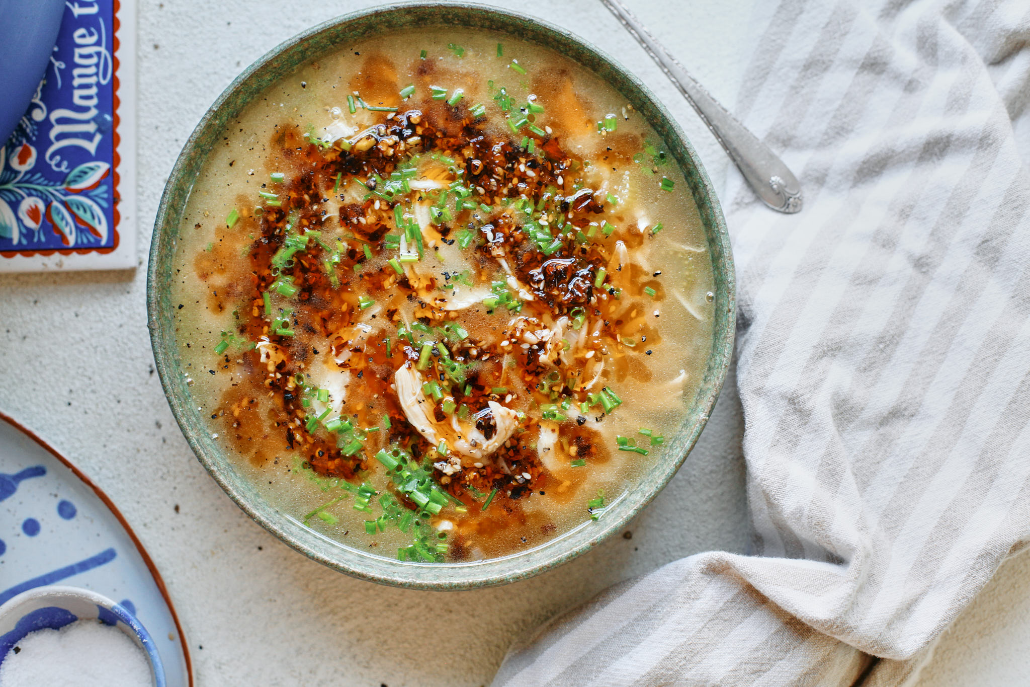 toasted orzo chicken soup with chili crisp on top