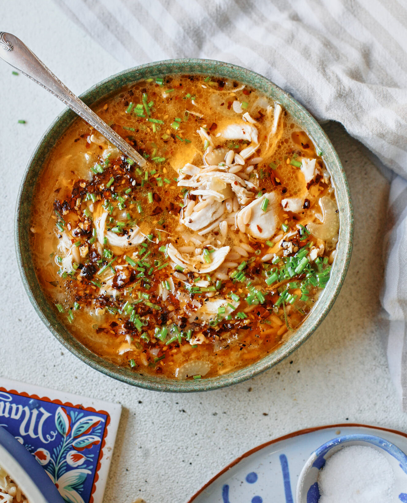 toasted orzo chicken soup with chili crisp on top