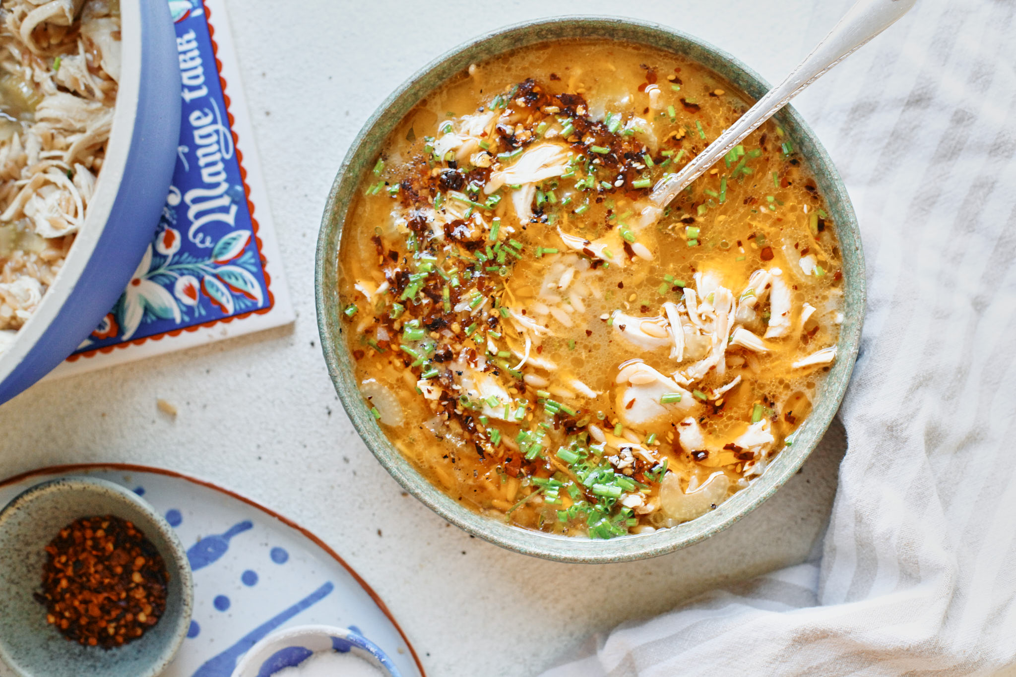 toasted orzo chicken soup with chili crisp on top