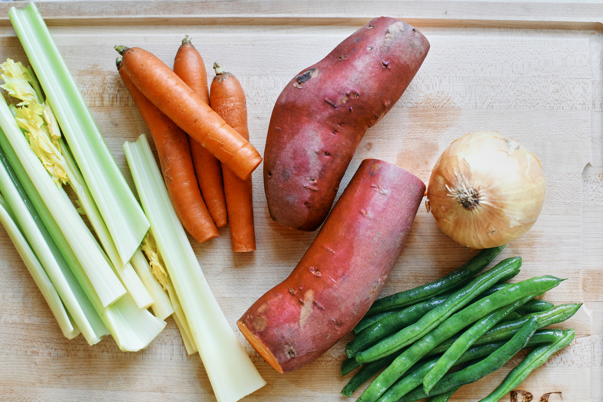 prep for the rustic vegetable farro soup: celery, carrots, sweet potato, onion and green beans