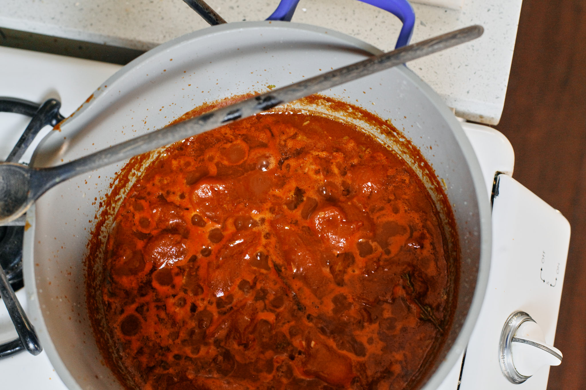 tomatoes simmering in the pot for the Creamy Tomato Ravioli Soup