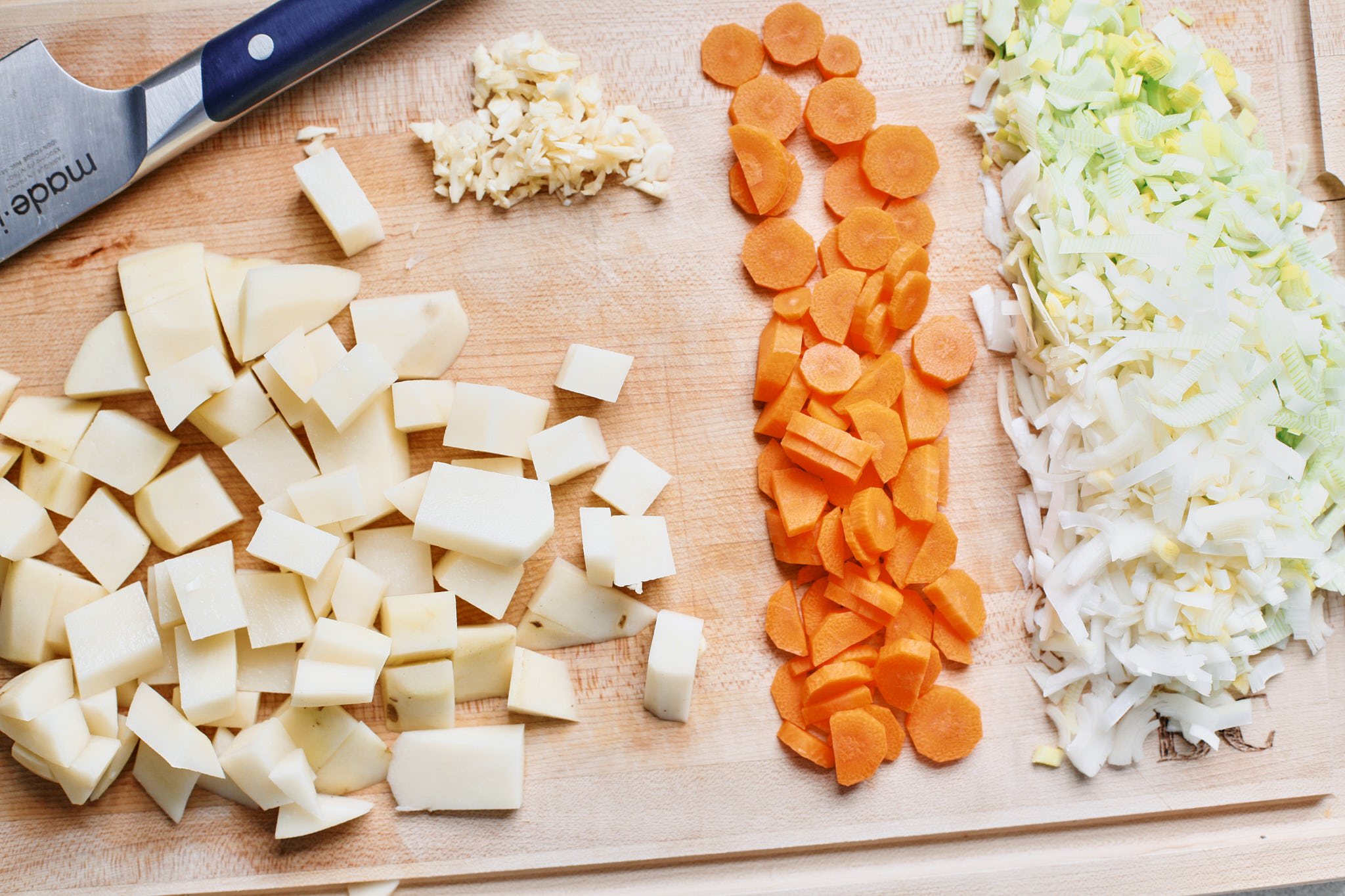 prep for the crispy gnocchi ham & leek soup - chopped potato, garlic, carrot and leek