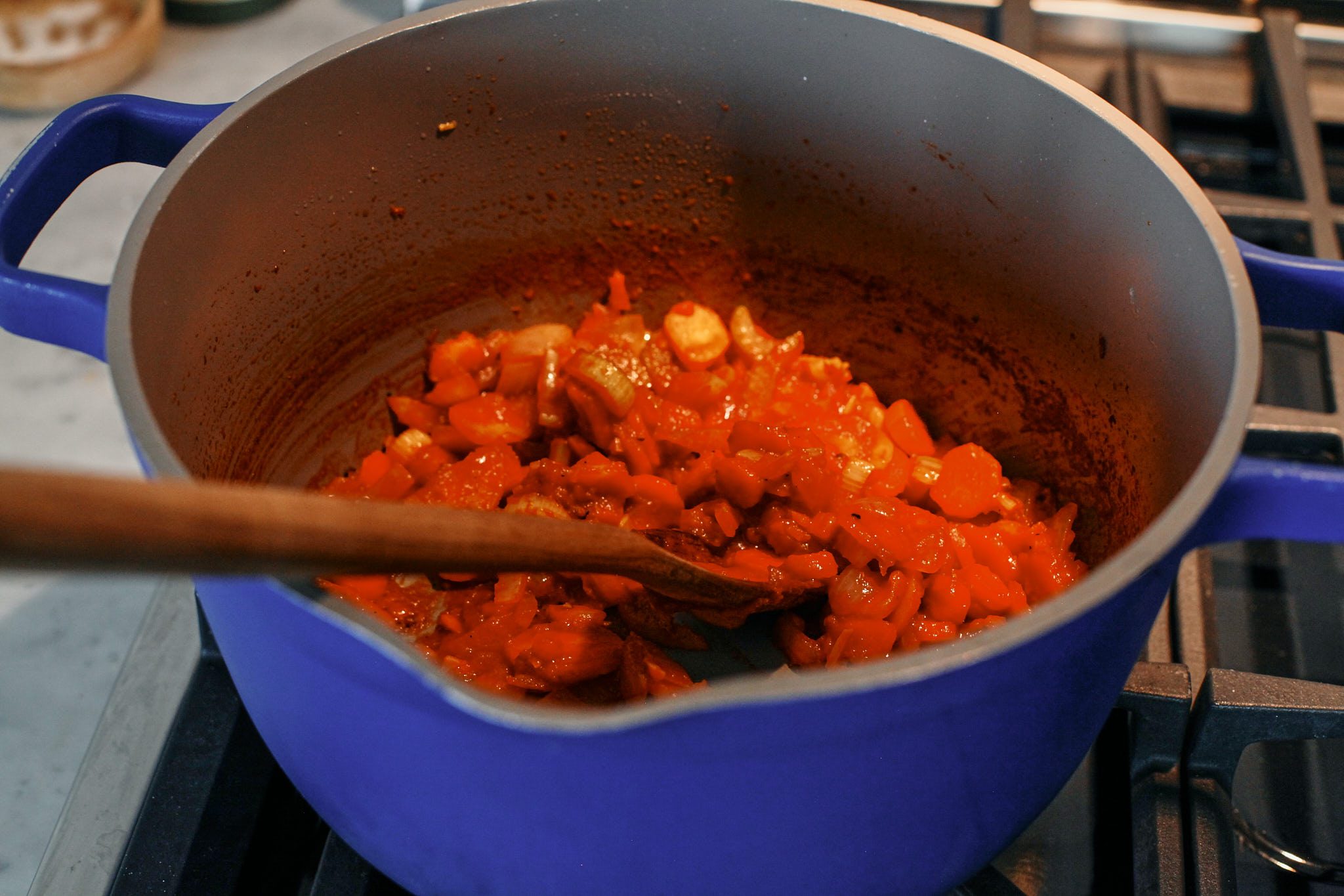 prep for the creamy tortellini vegetable soup: chopped celery, carrots, parsnip, onion and garlic sautéeing with tomato paste in the pot