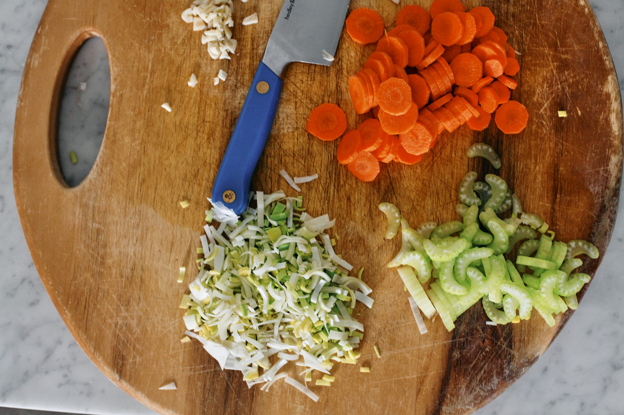 prep for the hearty Italian bean and orzo stew: chopped celery, carrots, leek and garlic.