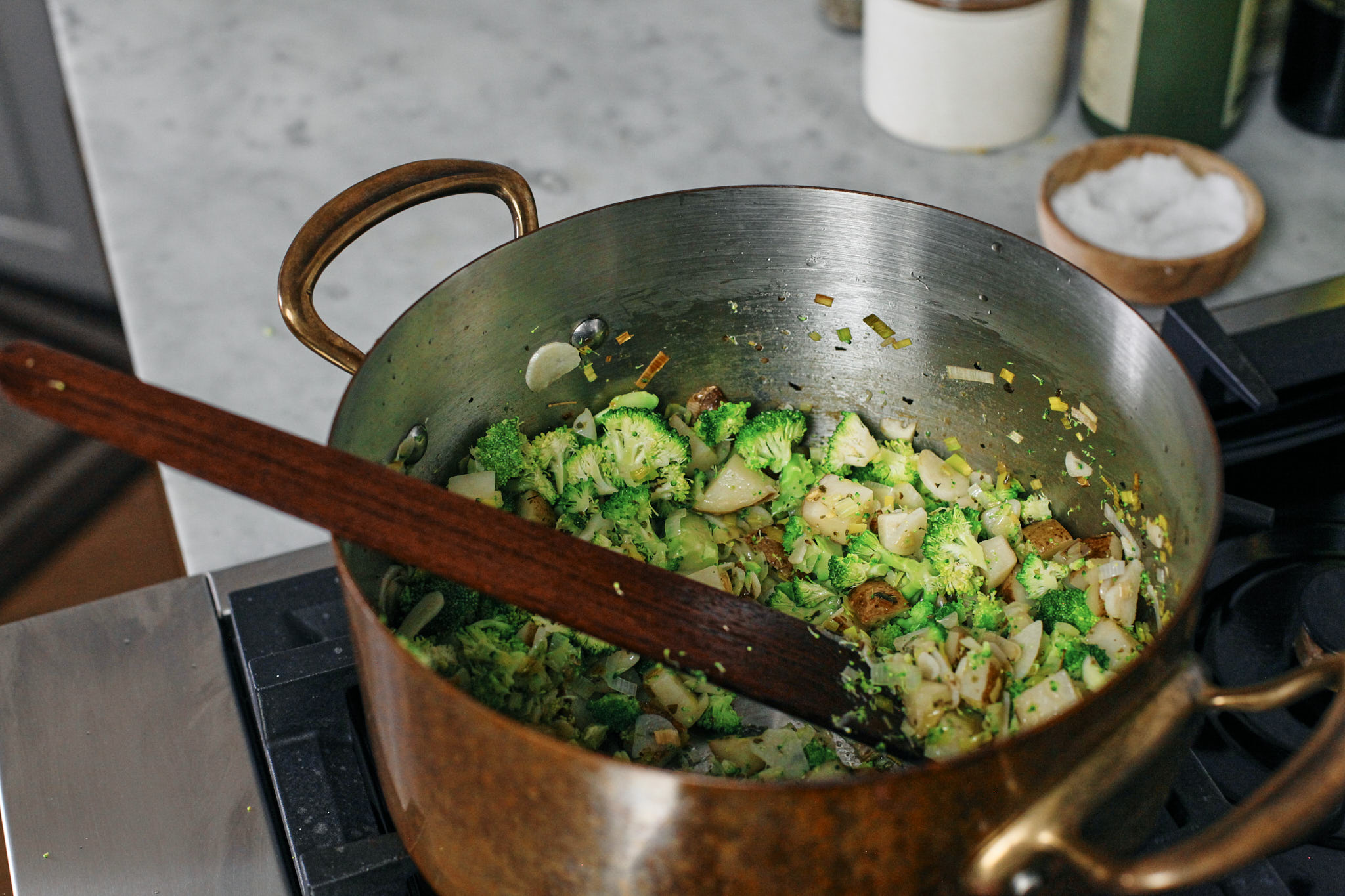 potato, leek and garlic and broccoli sautéeing in butter and olive oil with some salt, pepper and marjoram seasoning.