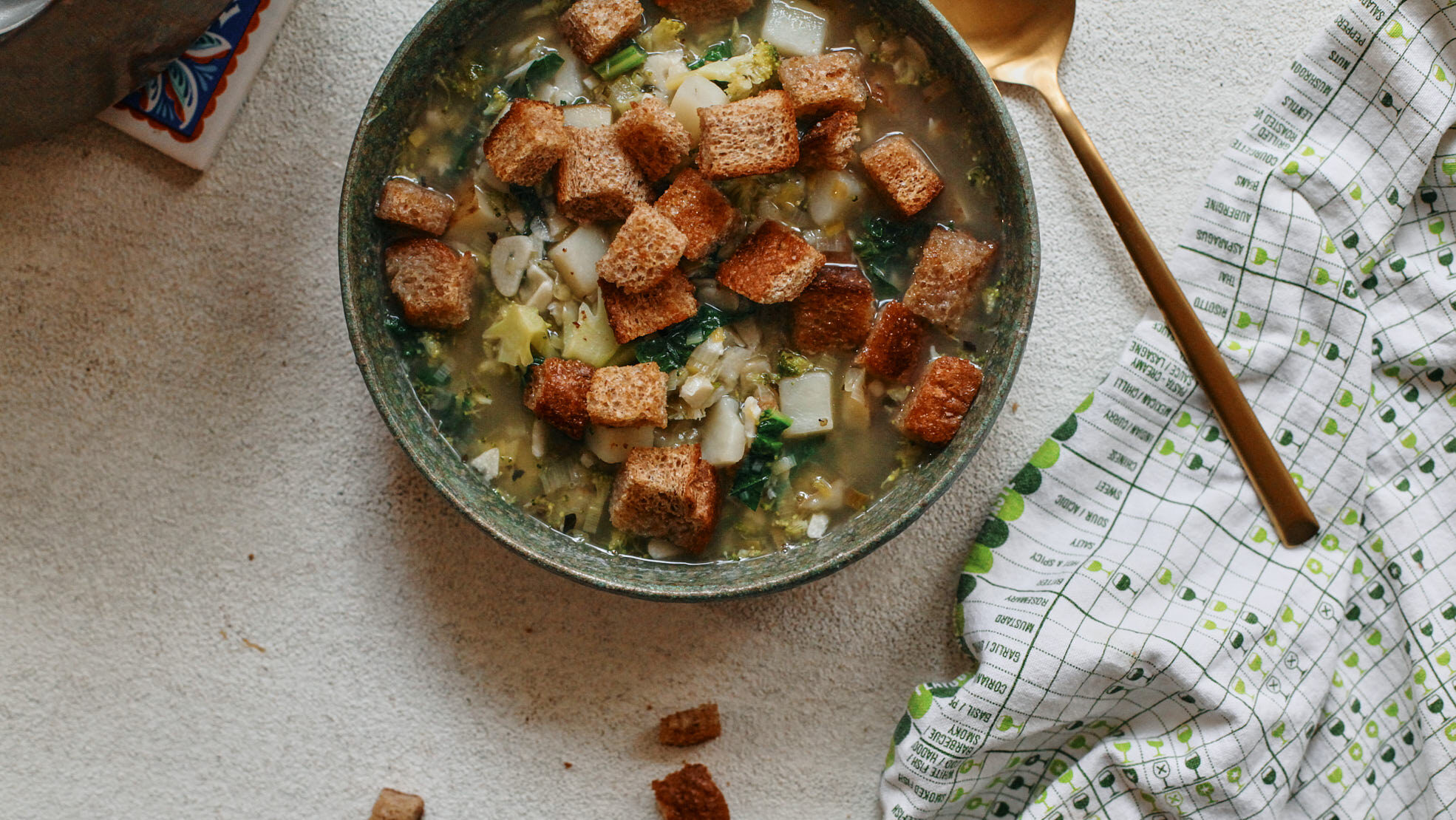 mighty greens garlic soup topped with croutons