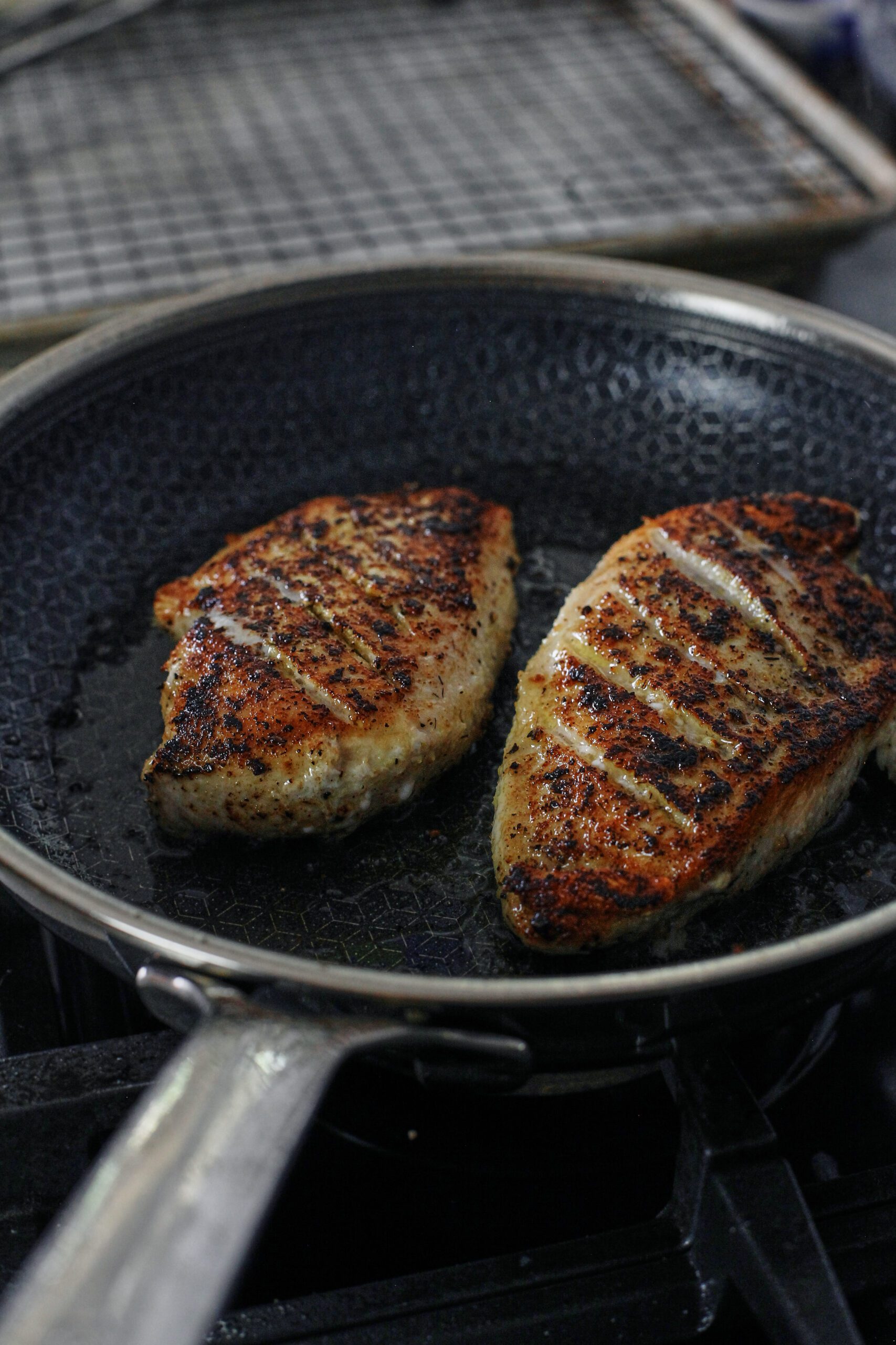 Chicken with Garlic Shallot Cream Sauce 14 seasoned chicken breasts searing in the pan