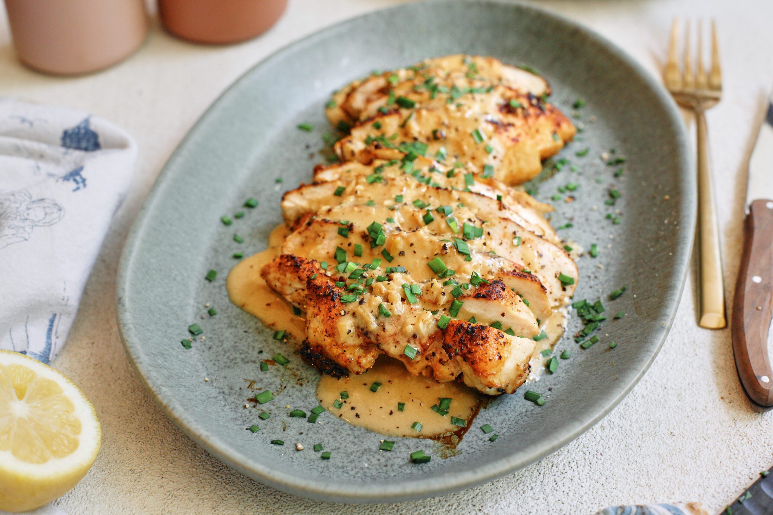 Chicken with Garlic Shallot Cream Sauce 32 sliced chicken breast with the garlic shallot cream sauce poured on top finished with chives
