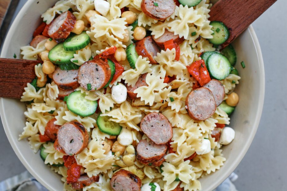 high protein pasta salad in a large bowl, tossed to combine