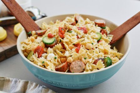 high protein pasta salad in a large bowl, tossed to combine