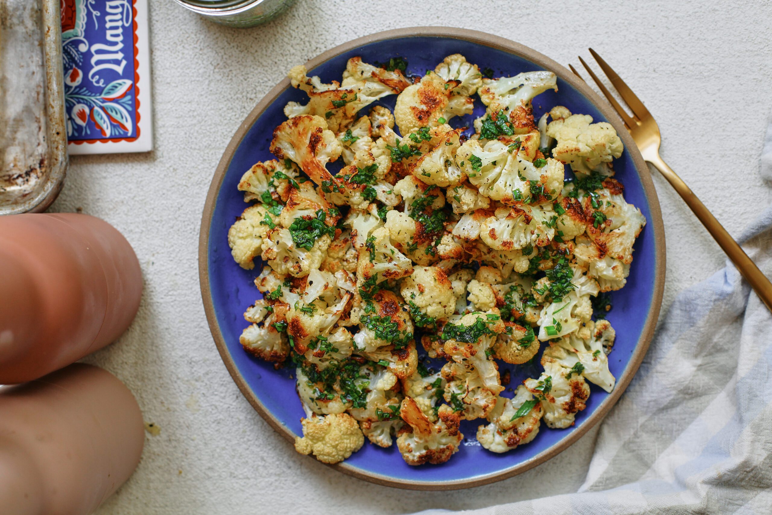 Salt and Vinegar Cauliflower 12 salt and vinegar cauliflower on a blue plate