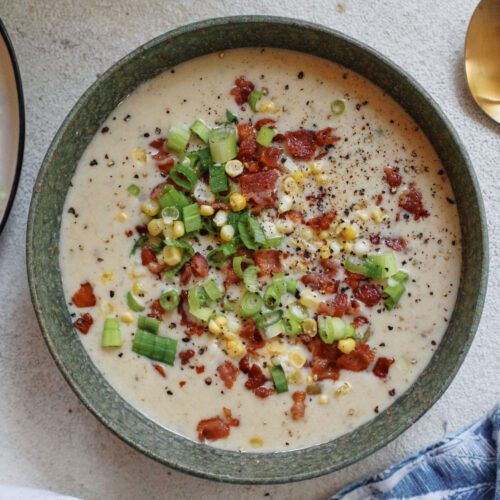 creamy corn chowder topped with green onions, bacon, and black pepper