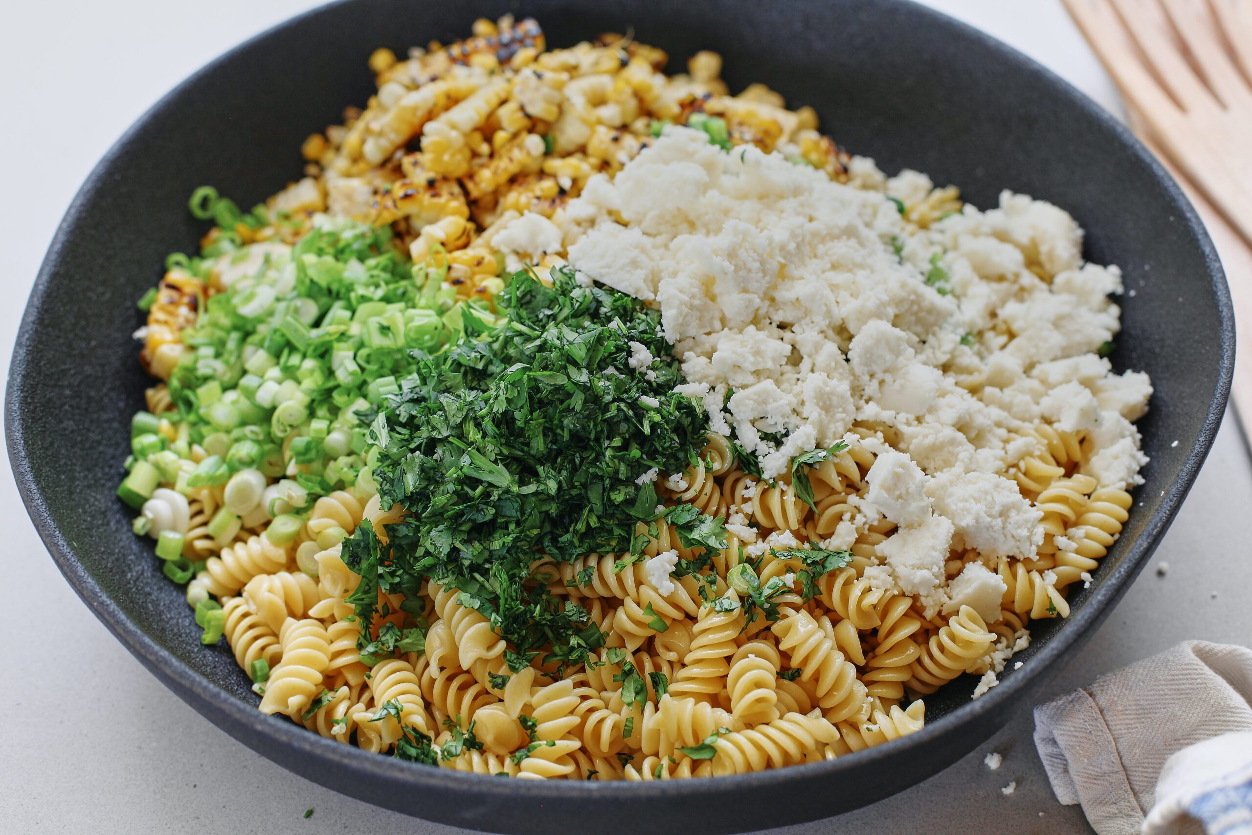 elote pasta salad before mixing or adding the dressing
