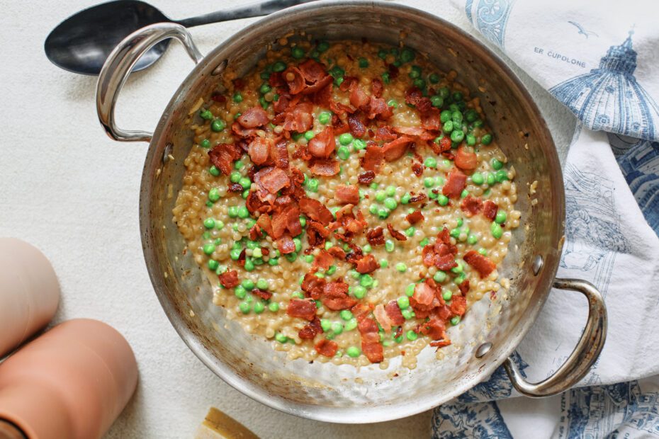 pearl couscous with bacon & peas in a large sauté pan before serving