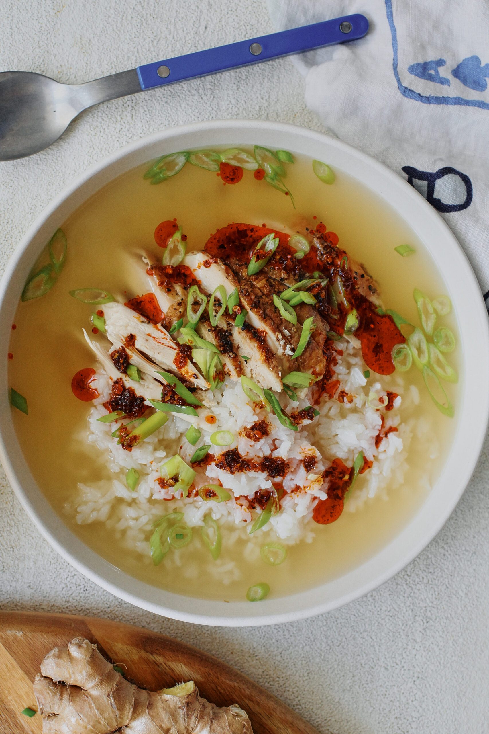 french press chicken and rice soup in a large, shallow white bowl