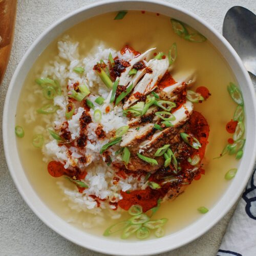 french press chicken and rice soup in a large, shallow white bowl