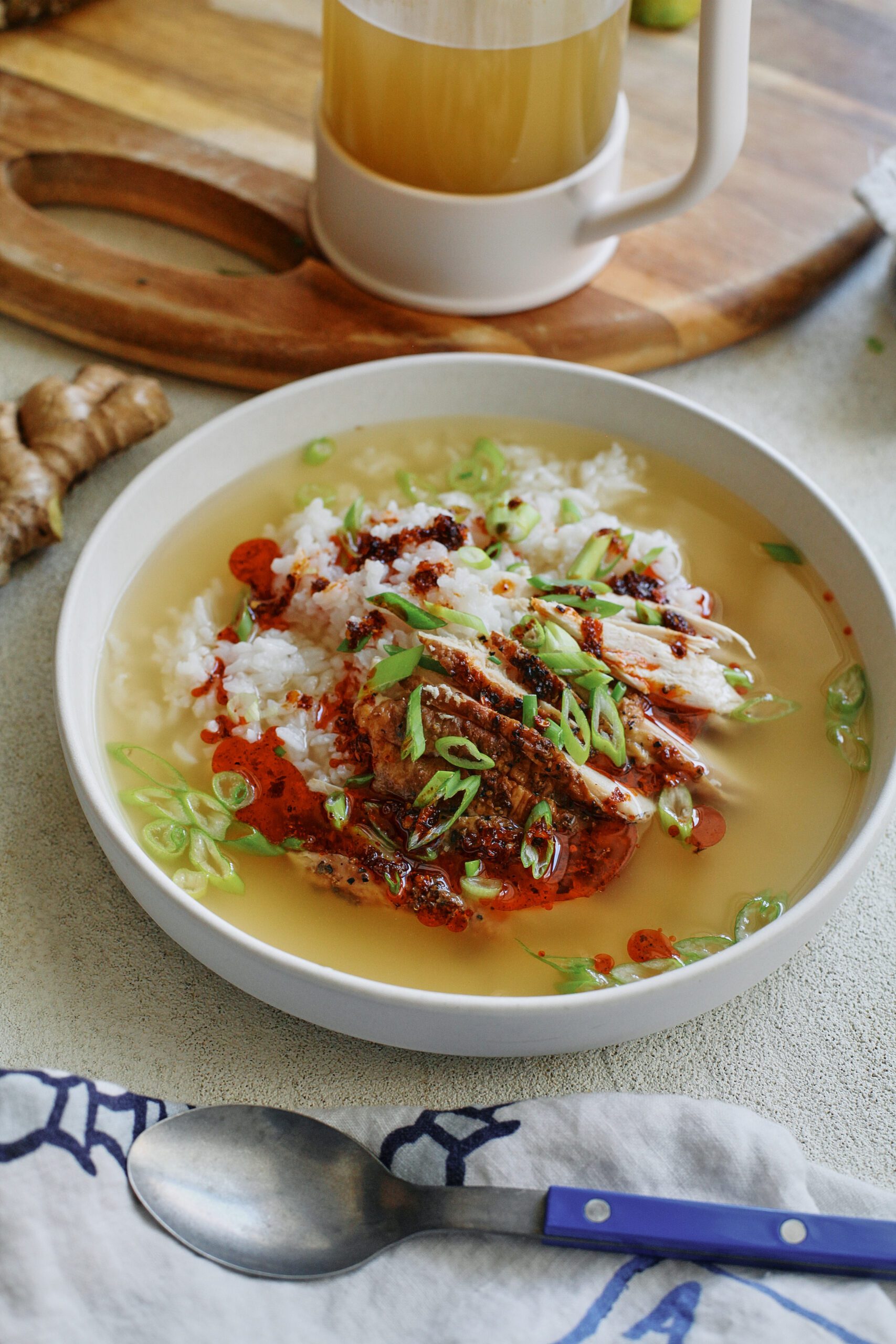 french press chicken and rice soup in a large, shallow white bowl