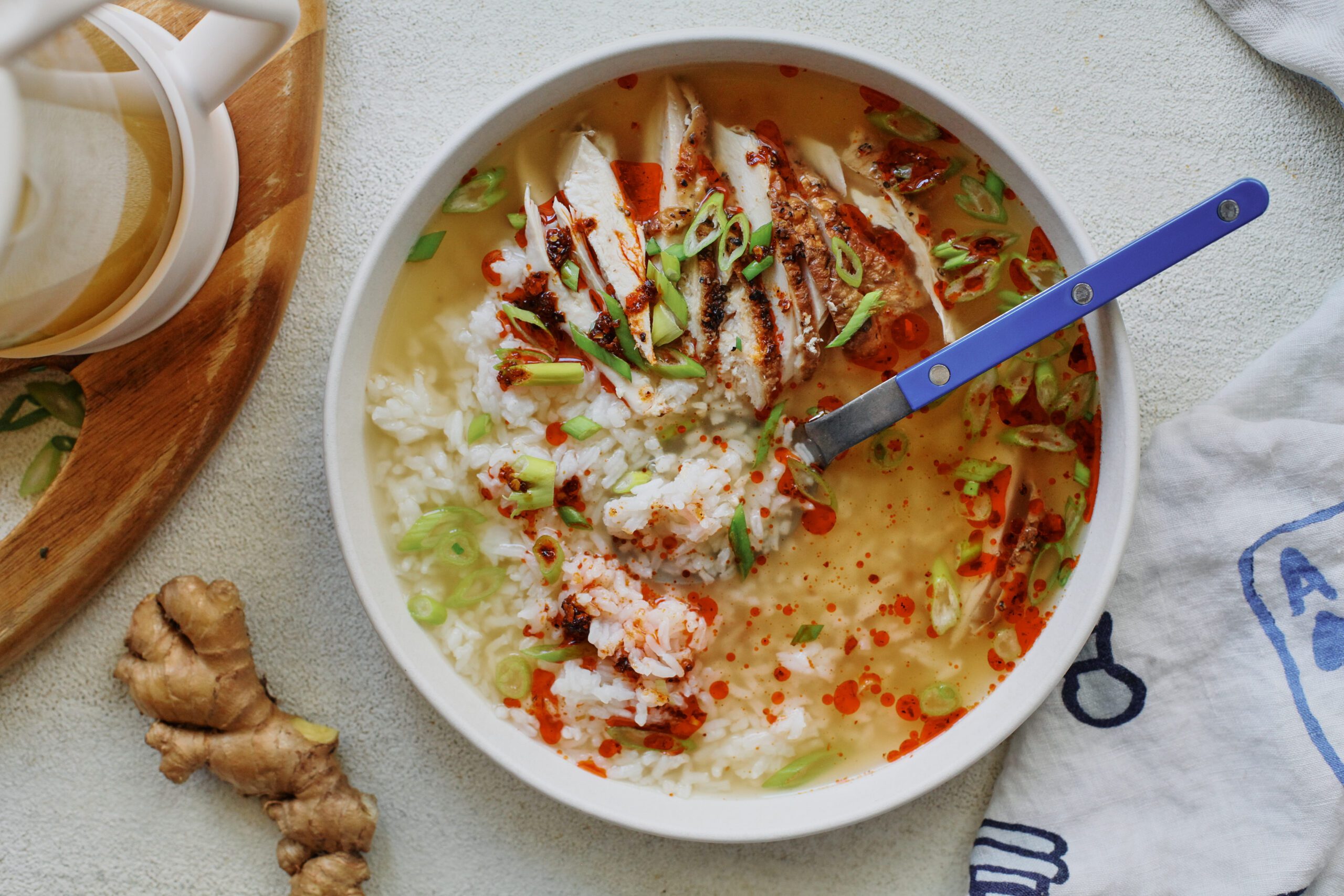 french press chicken and rice soup in a large, shallow white bowl