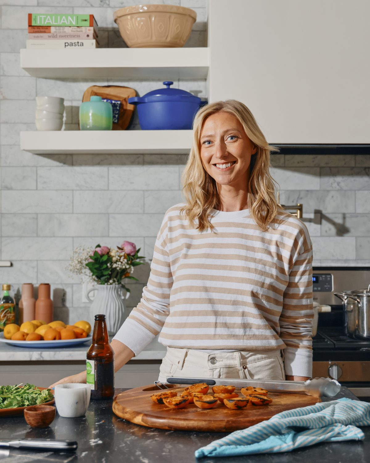 Brita standing at counter smiling