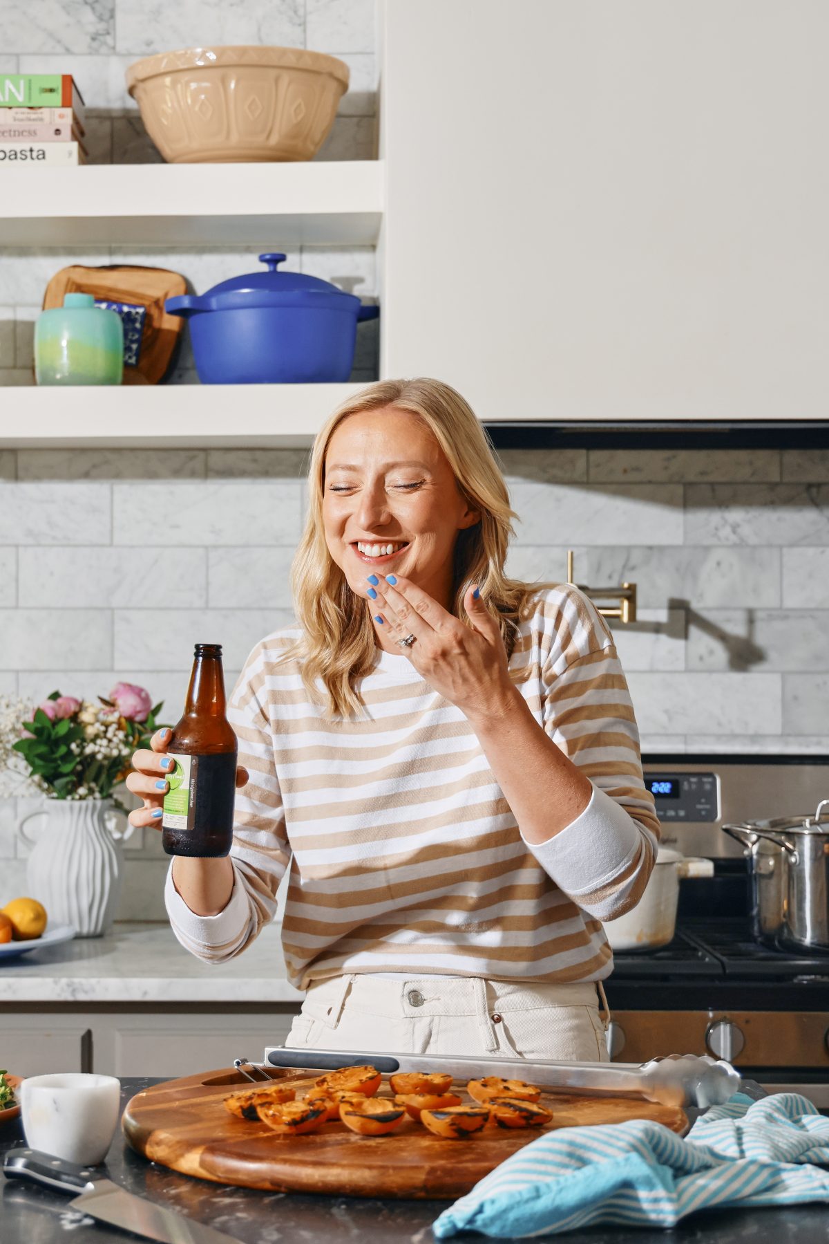 Brita laughing after taking a sip
