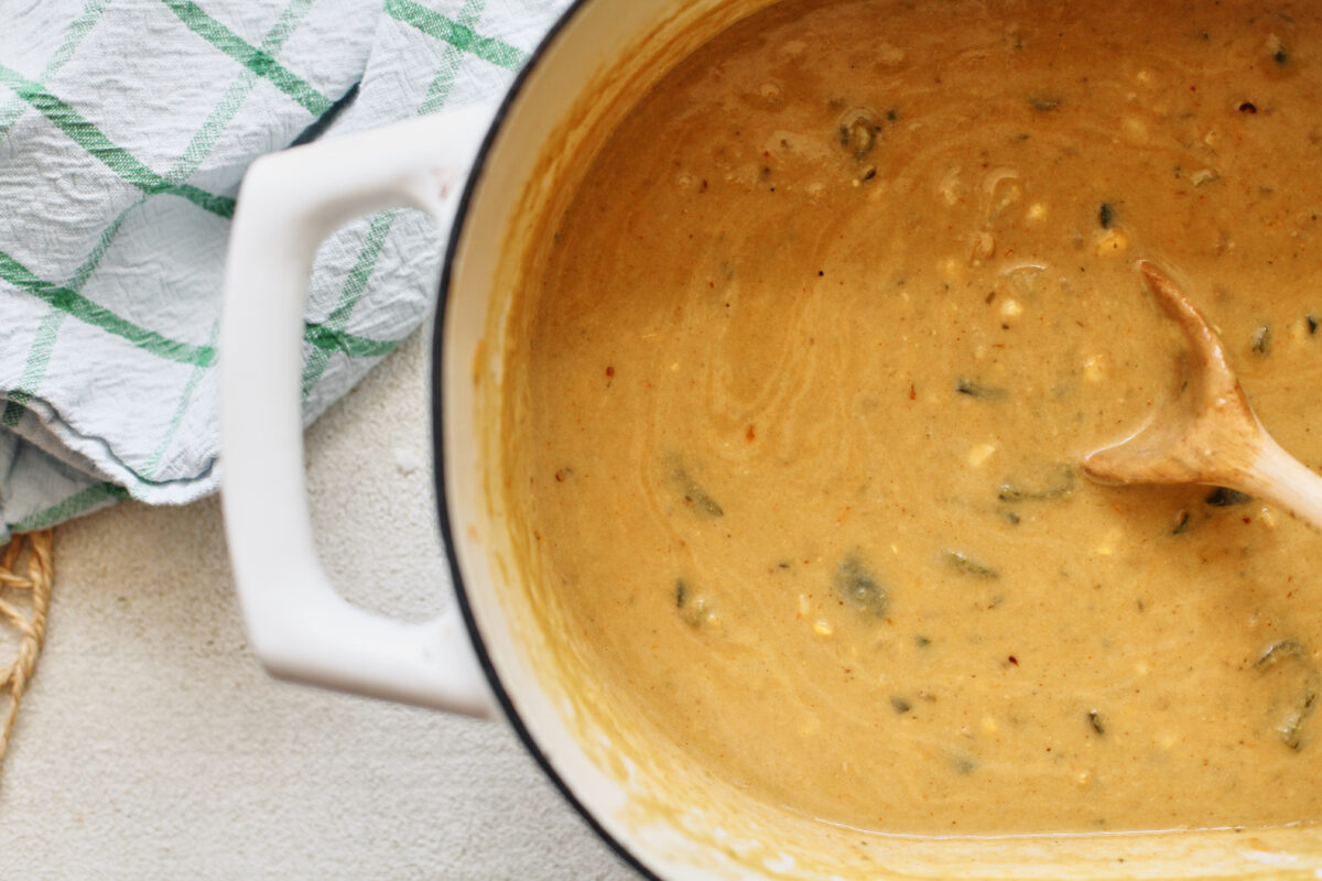 creamy poblano corn chowder in a white dutch oven